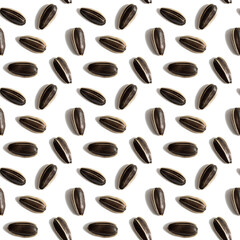 Black sunflower seeds isolated on white background. Raw whole grains