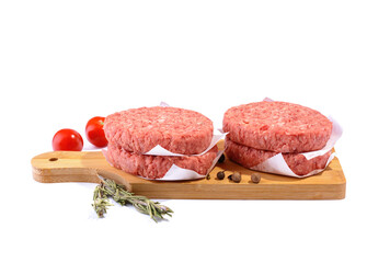 Raw beef patties for making a burger.Isolated on a white background.Selective Focus.