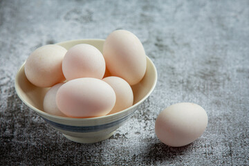 Duck eggs on dark background