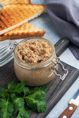 Homemade chicken liver pate in a glass jar.