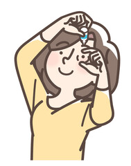 Obraz premium 目薬をさす女性