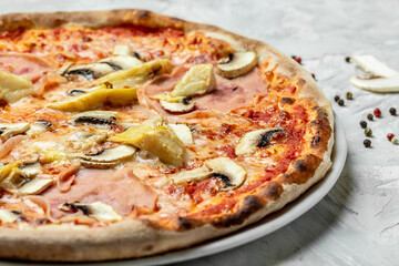 capriciosa pizza. Italian pizza is cooked in a wood-fired oven. banner, menu recipe. top view