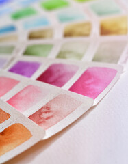 Close-up color palette in shades of pink, purple and brown.