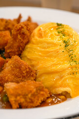 A tempting and delicious Japanese curry fried chicken omelet rice
