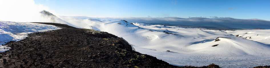 Panorama of snowy landscape at Fimmvoerduhals hiking trail in the early morning