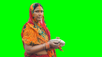 Woman celebrating Chhath Pooja on a green background