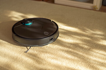 Robotic vacuum cleaner on carpet, smart appliances in the home