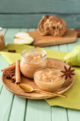 Tasty pear jam on wooden table