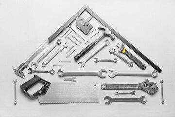 Composition with construction tools on light background