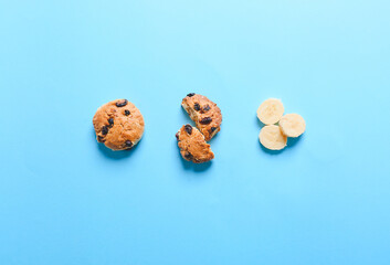 Composition with tasty banana cookies on color background