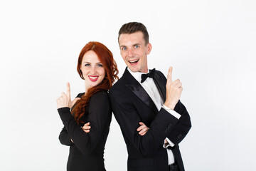 Man and woman actors performing on the stage, white background. Smiling man and woman with folded arms backs to each other on white background with copy space
