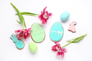Beautiful composition with tasty Easter cookies on white background