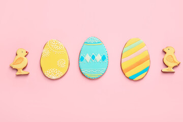 Tasty Easter cookies on color background