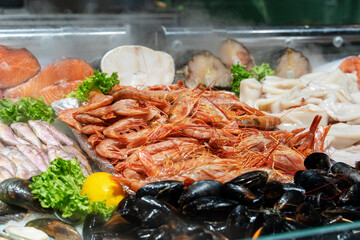 Fresh Fish at Seafood Market, Traditional Fish in Market. Fresh Sea Fish in on Showcase of Seafood Street Market.