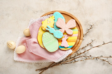 Dessert stand with tasty Easter cookies on grey background