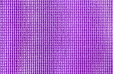 Texture of purple color yoga mat for background and design art work.