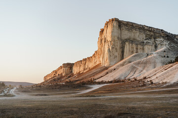 Beautiful white rock and field in a sunset, scenic view