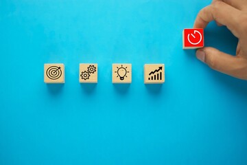 Business process management, Businessman plan a project with wooden cubes with icon business...