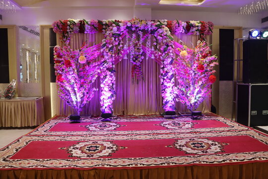 New Delhi, Delhi India- March 04 2021: Background of the specially decorated banquet hall with decent violet flowers.
