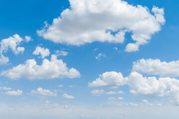 Naklejka na ściany i meble Blue clear sky with white fluffy clouds. Natural background
