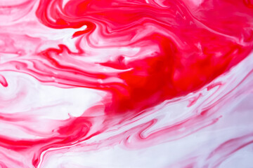 Red and white fluid art, abstract creative background with acrylic paints. Dynamic lines, free movement, outburst of emotions, passion, free natural form. The concept of strawberries with cream.