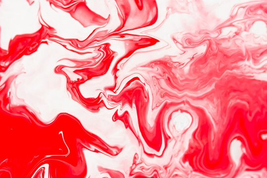 Red and white fluid art, abstract creative background with acrylic paints. Dynamic lines, free movement, outburst of emotions, passion, free natural form. The concept of strawberries with cream.