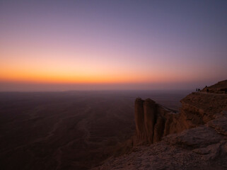 Fototapeta na wymiar Sunset views at the Edge of the World escarpment tourist area near Riyadh, Saudi Arabia