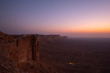 Fototapeta na wymiar Sunset views at the Edge of the World escarpment tourist area near Riyadh, Saudi Arabia