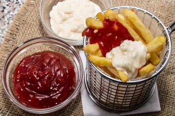 french fries red and white with ketchup and mayonnaise