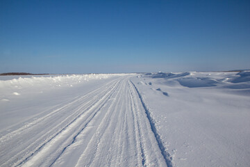 Fototapeta na wymiar Ice road - travel north. Winter road is a winter road in the north. 