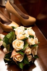 Bridal bouquet and brides' shoes in the background