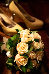 Bridal bouquet and brides' shoes in the background