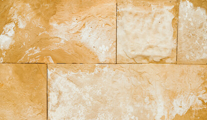 The texture of the stone is beige.Rock, decorative stone. Rough texture of the stone.