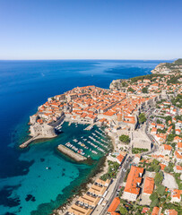 Aerial drone shot of Old Port in Dubrovnik old town in Croatia summer morning