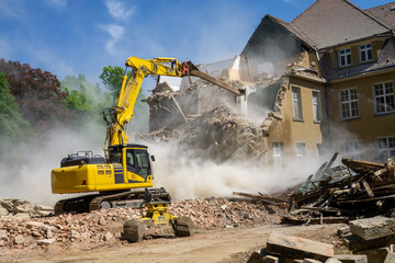 Construction industrial site digger yellow demolishing house for reconstruction - obrazy, fototapety, plakaty