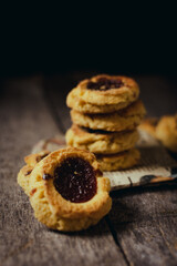 Quince cookies on rustic wooden board and black background