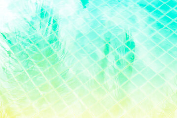 Abstract coconut leaves shadow on swimming pool water, vintage filter, tropical concept background