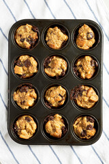 Homemade Chocolate Banana Bread Pudding in a baking dish, top view. Flat lay, overhead, from above.