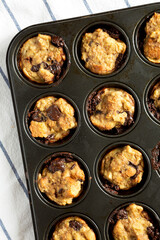 Homemade Chocolate Banana Bread Pudding in a baking dish, top view. Flat lay, overhead, from above.