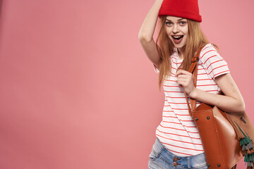 Naklejka premium Emotional woman fashion clothes studio fun pink background