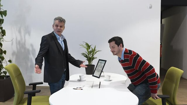Llama being walked past a business meeting interview in an office.