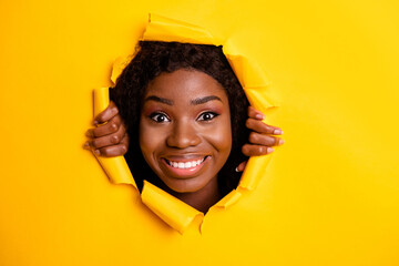 Photo of positive funny adorable lady toothy smile look camera through bright yellow color background