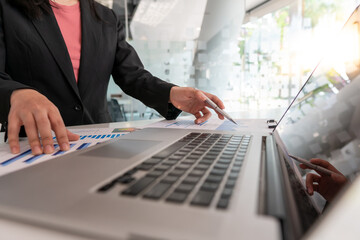 Business people working with graphs, business documents on their desks to analyze for business startups.