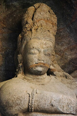 Fototapeta na wymiar Carved idol of stone inside Cave 1, Elephanta Caves, Gharapuri island, Mumbai, Maharashtra, India
