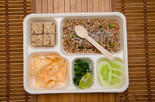 Upvaas Thali or food specially made for fasting, in Maharashtra includes Sabudana khichadi, Rajgira Wadi sweet, papad and Cucumber slices