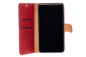 Mobile phone screen. Close-up of a smartphone in a red brown leather mobile phone case with black...