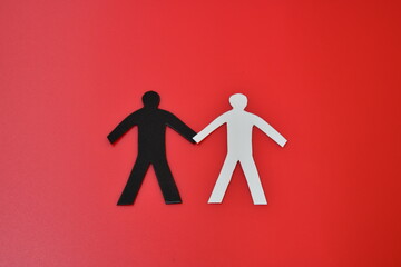 black and white figure on a red background