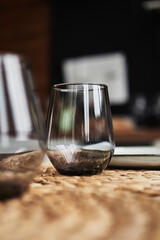 glass goblet on a wicker napkin on the table