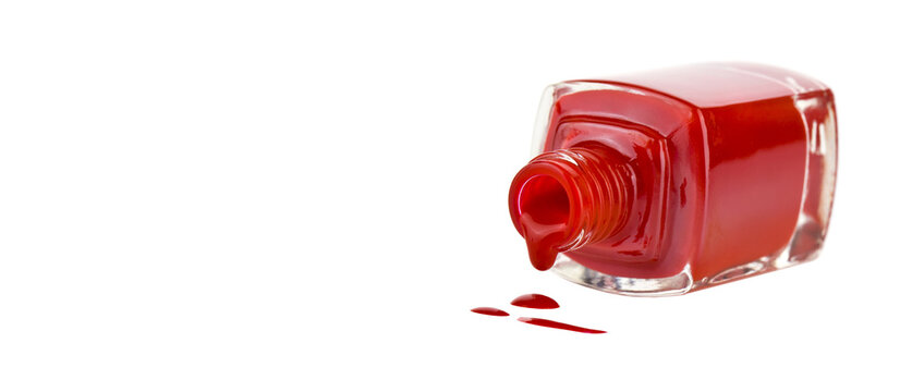 Bottle with red nail polish products isolated on white background close up.