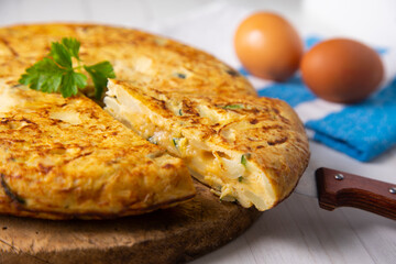 Traditional Spanish omelette with potatoes and zuuchini